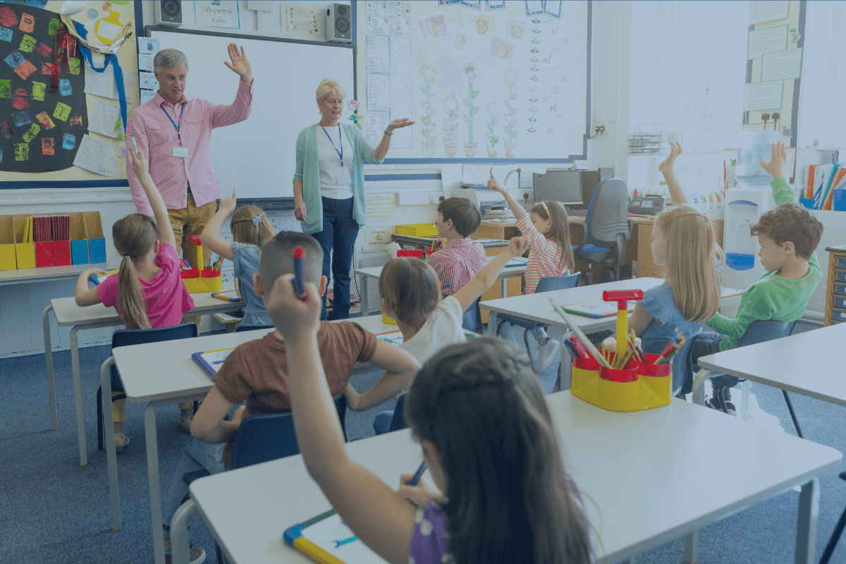 Child learning in a classroom supported by Mojo Helpdesk. Education help desk software trusted by Directors of Support, VPs of Product Management, and K-12 IT Directors to streamline school technology and student support.