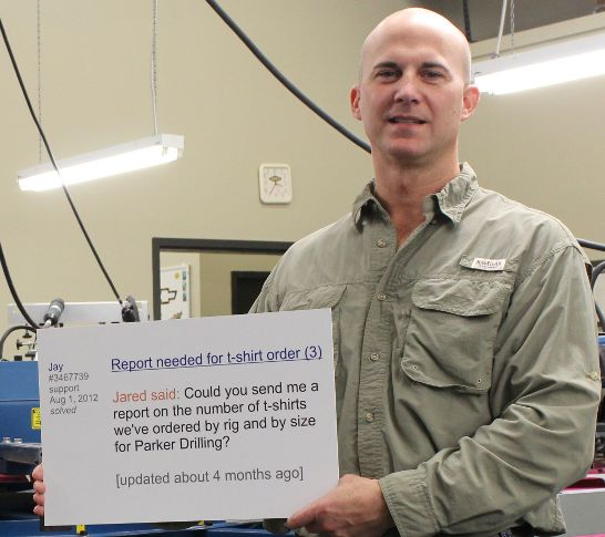 46 Jay Roth holding a sign