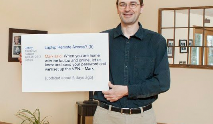 Mark Holding Sign